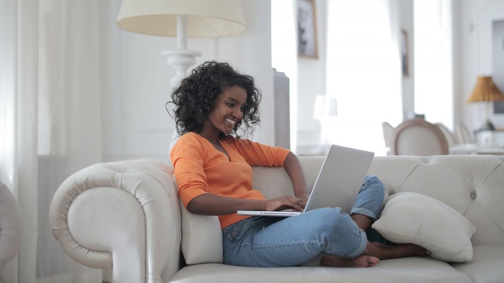 Woman working remotely reading blog on procurement during COVID-19