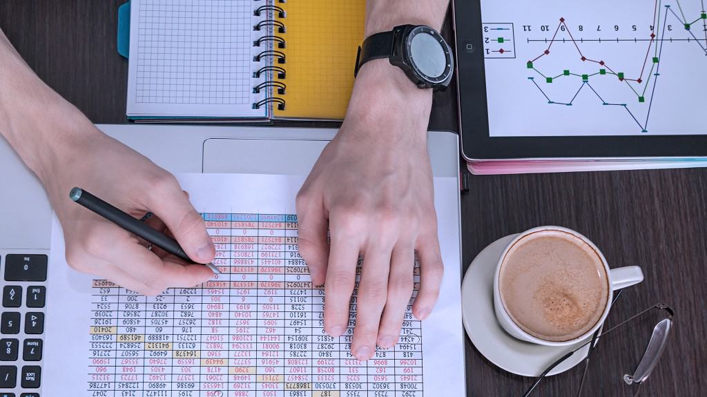 person taking risk using excel sheets for RFP