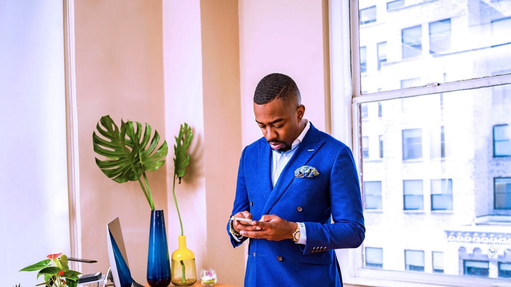 public procurement manager looking at phone for resources